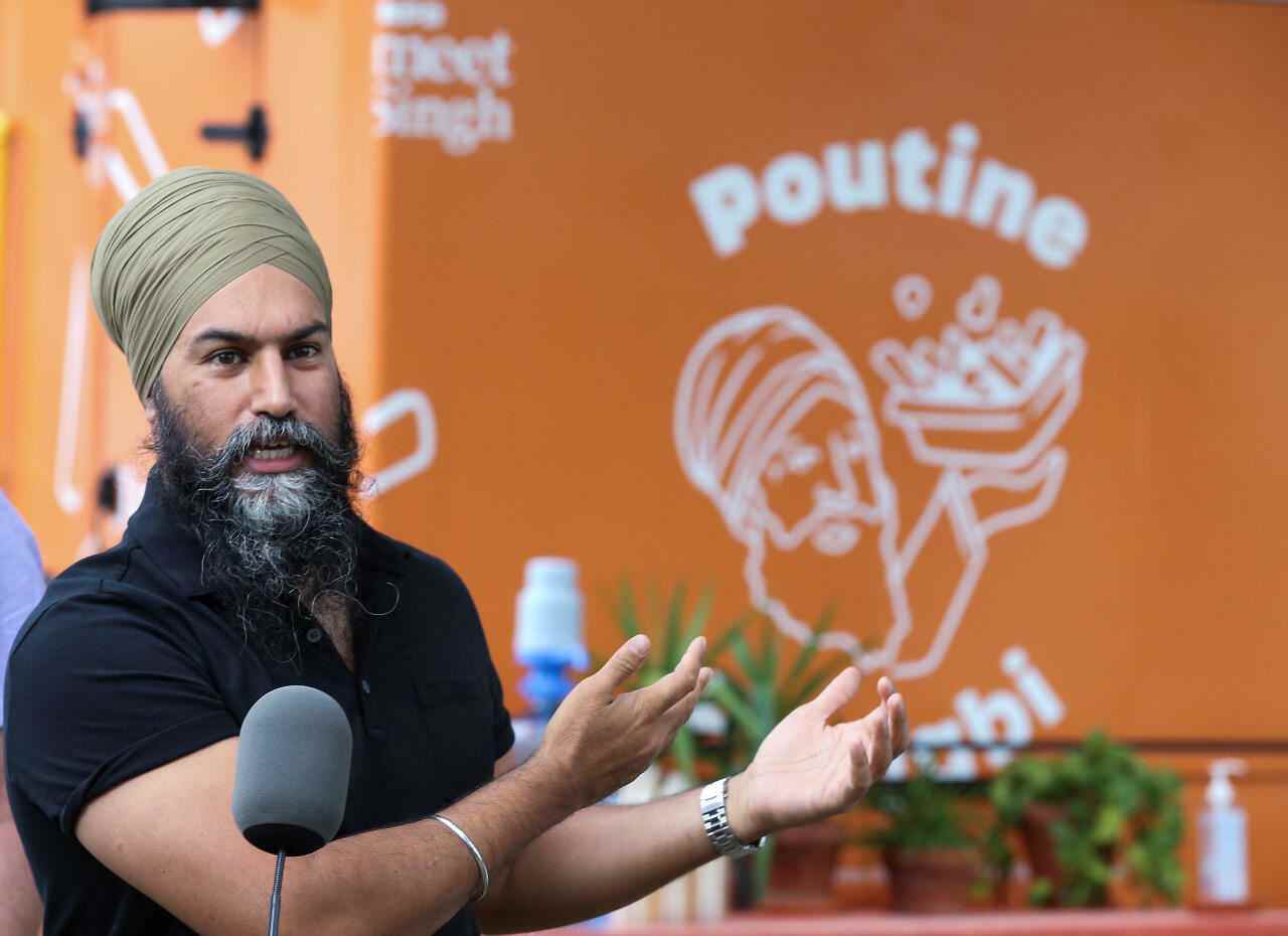 New Democratic Party (NDP) leader Jagmeet Singh speaks to the press in front of his poutine truck during an election campaign stop ahead of the TVA debate, at a park in Montreal, Quebec, Canada, on September 2, 2021.