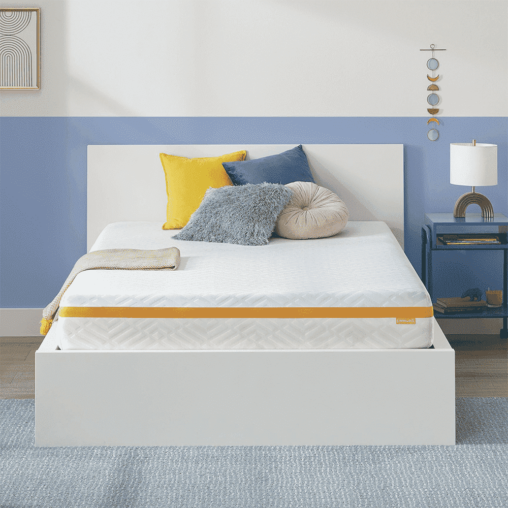 White mattress on a white bedframe