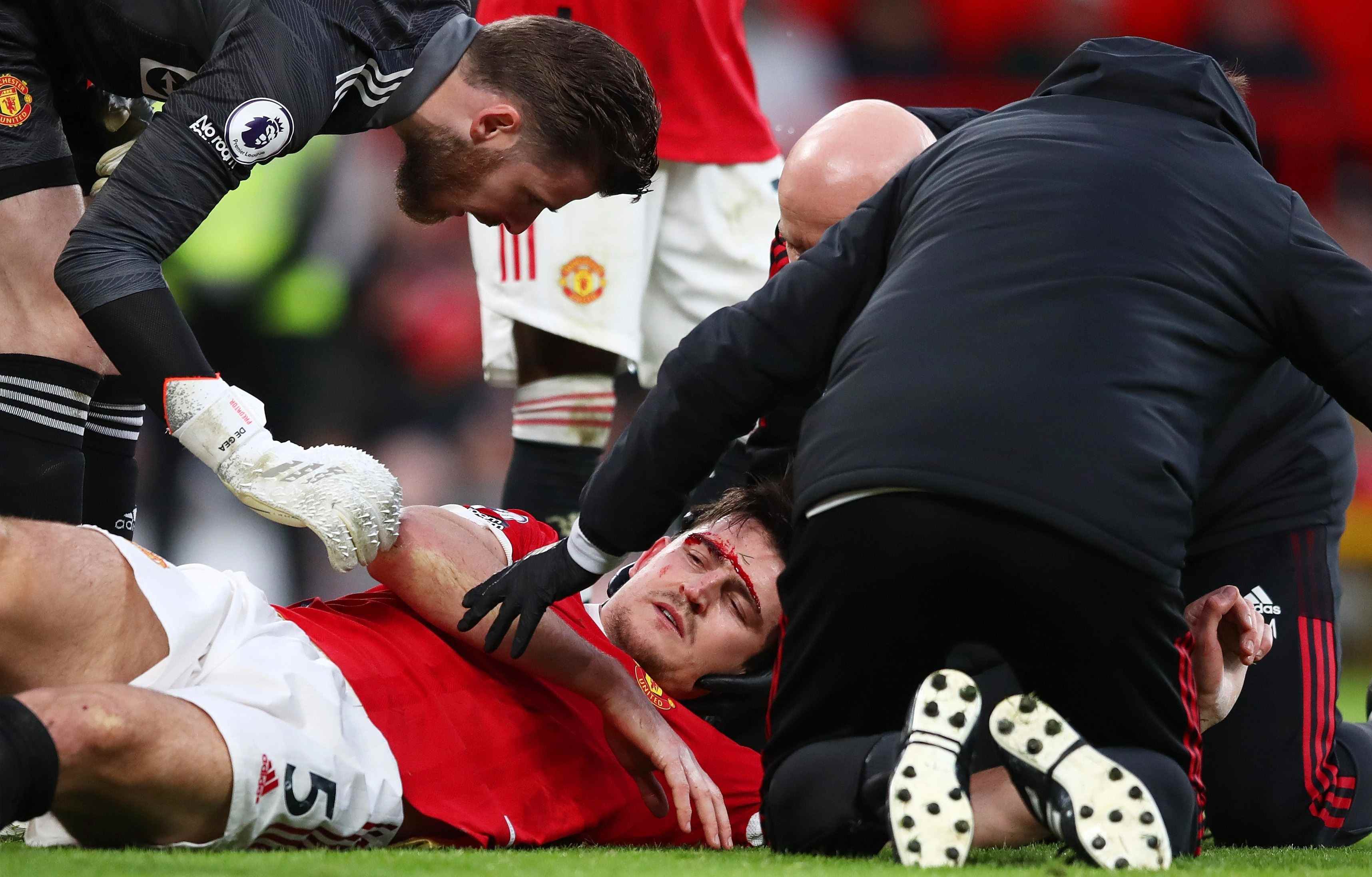Maguire looked wounded as he lay stricken on the floor after the head clash