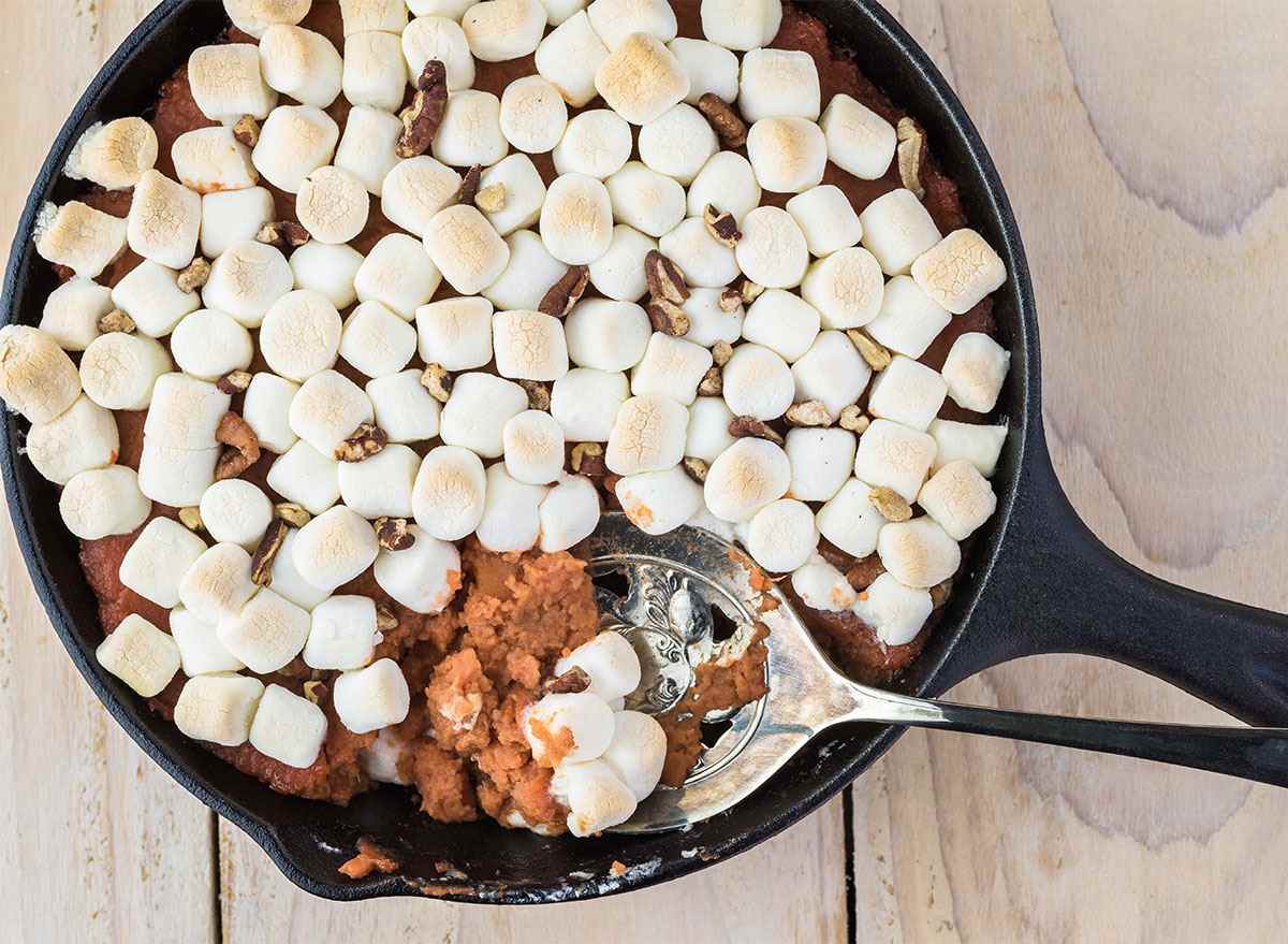 sweet potato casserole in a skillet topped with marshmallows