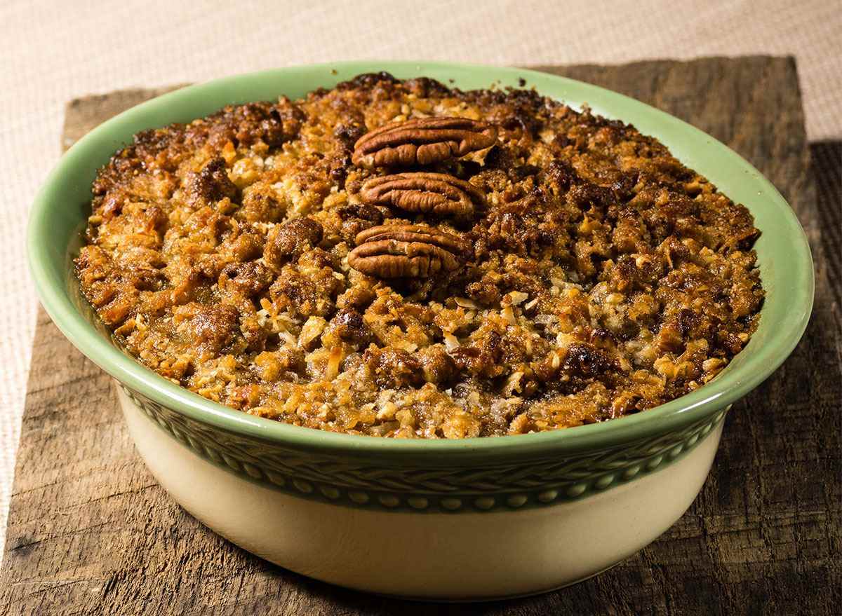 bowl of sweet potato casserole with pecan topping