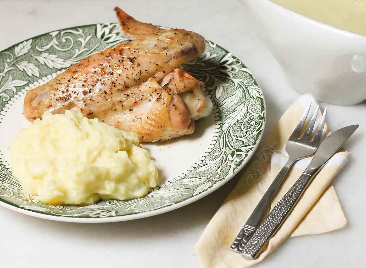 baked turkey wings with mashed potatoes on plate