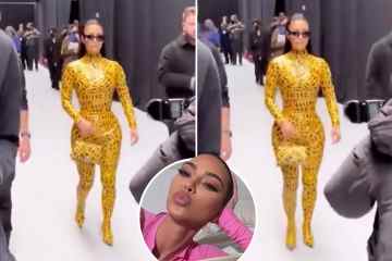 Kim bemüht sich, in einem hautengen gelben Warnband-Outfit zu GEHEN