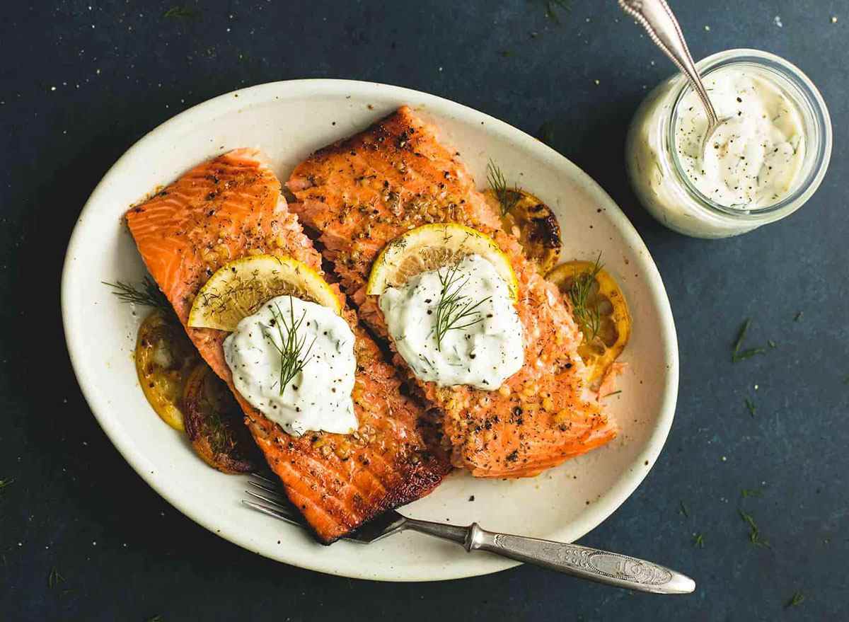 baked salmon with dill sauce on plate
