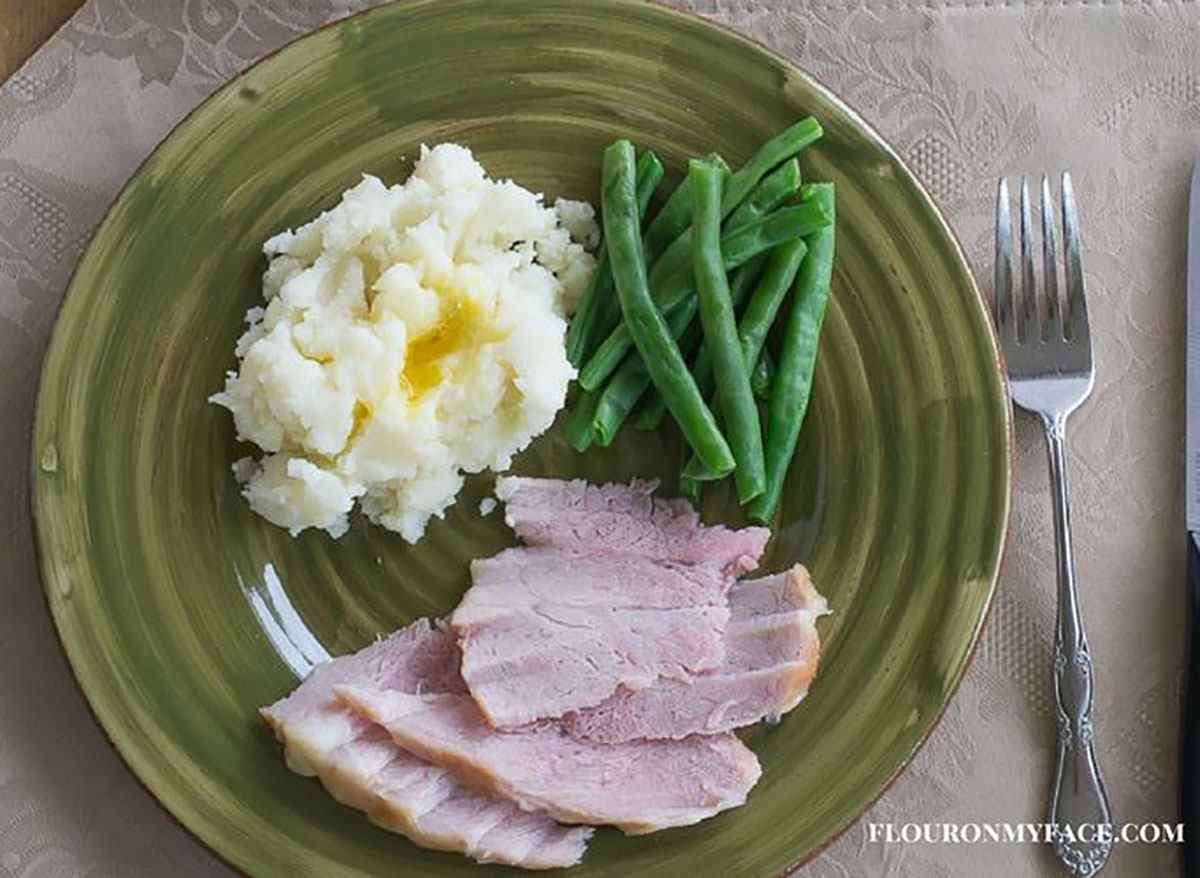 pineapple glazed ham with mashed potatoes and green beans