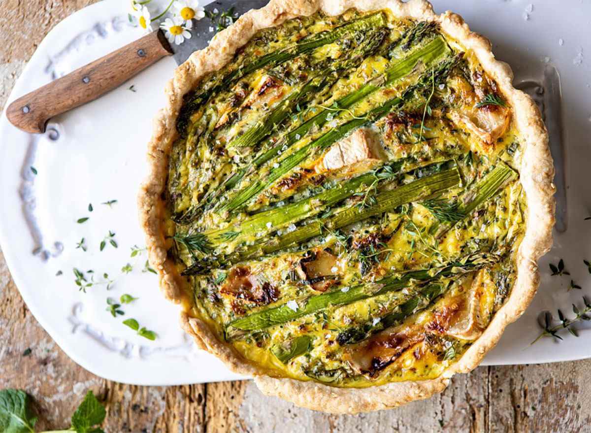 asparagus and brie quiche on platter
