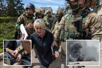 Spezialeinheiten stürzen sich auf eine Frau, die beschuldigt wird, russischen Invasoren geholfen zu haben