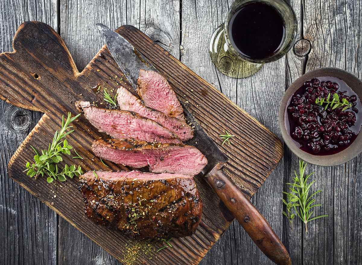 venison steak on cutting board