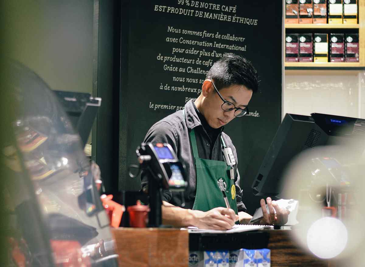 Starbucks barista working behind the counter
