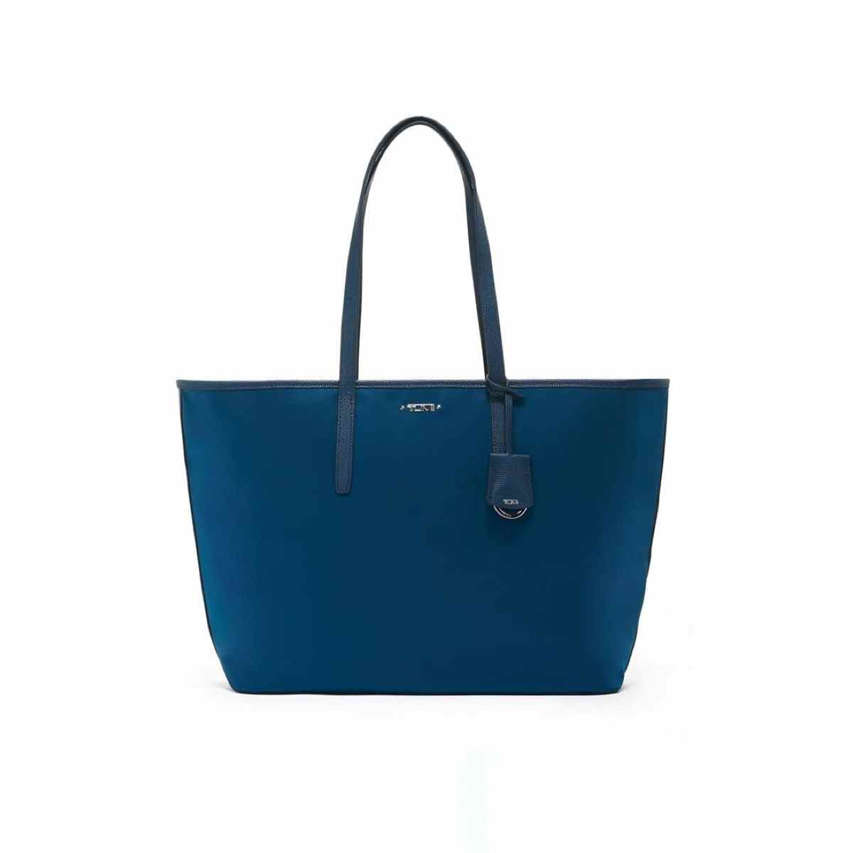 Dark turquoise Tumi Everyday Tote with leather straps on white background