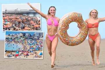 Briten strömen in Scharen an den Strand, um sich inmitten von bernsteinfarbener Hitzewarnung bei 30 ° C zu sonnen