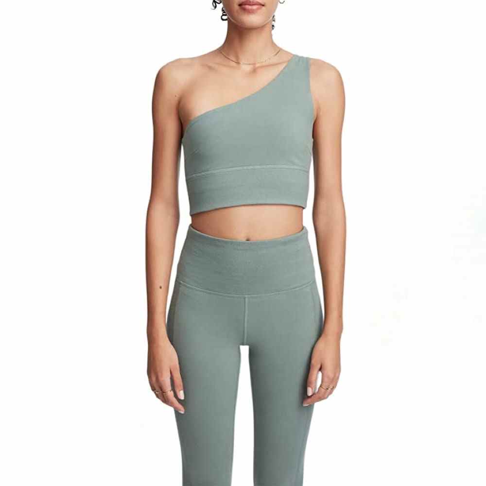 Green Bandier x Sincerely Jules The Ivy One Shoulder Bra on model wearing matching pants
