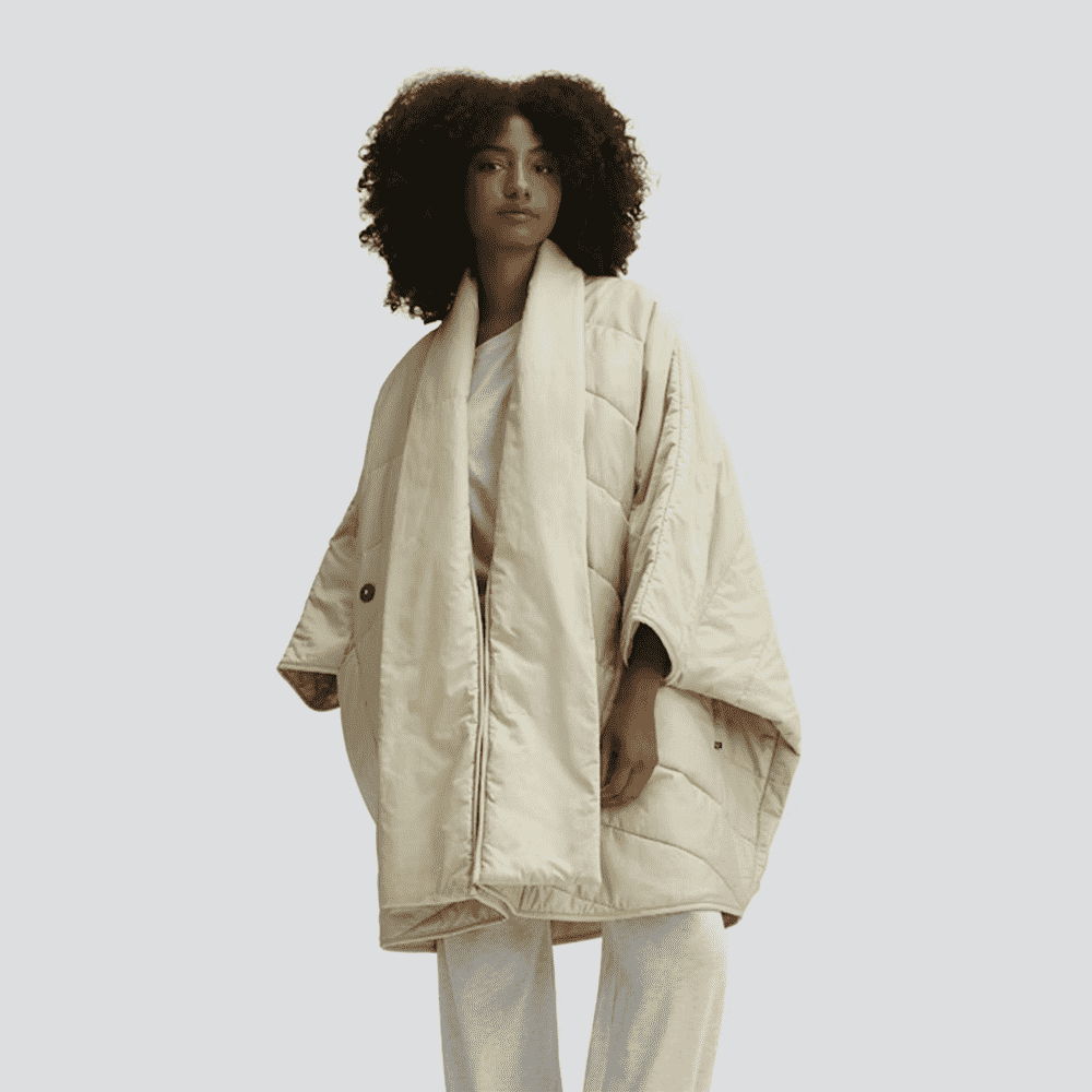 Model wearing a cream-colored blanket-style shawl robe