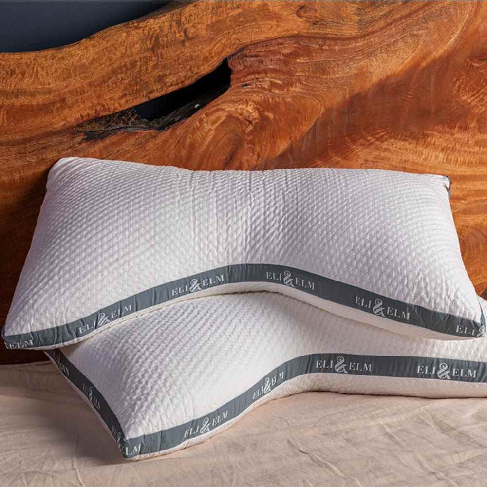 White pillows stacked on a bed