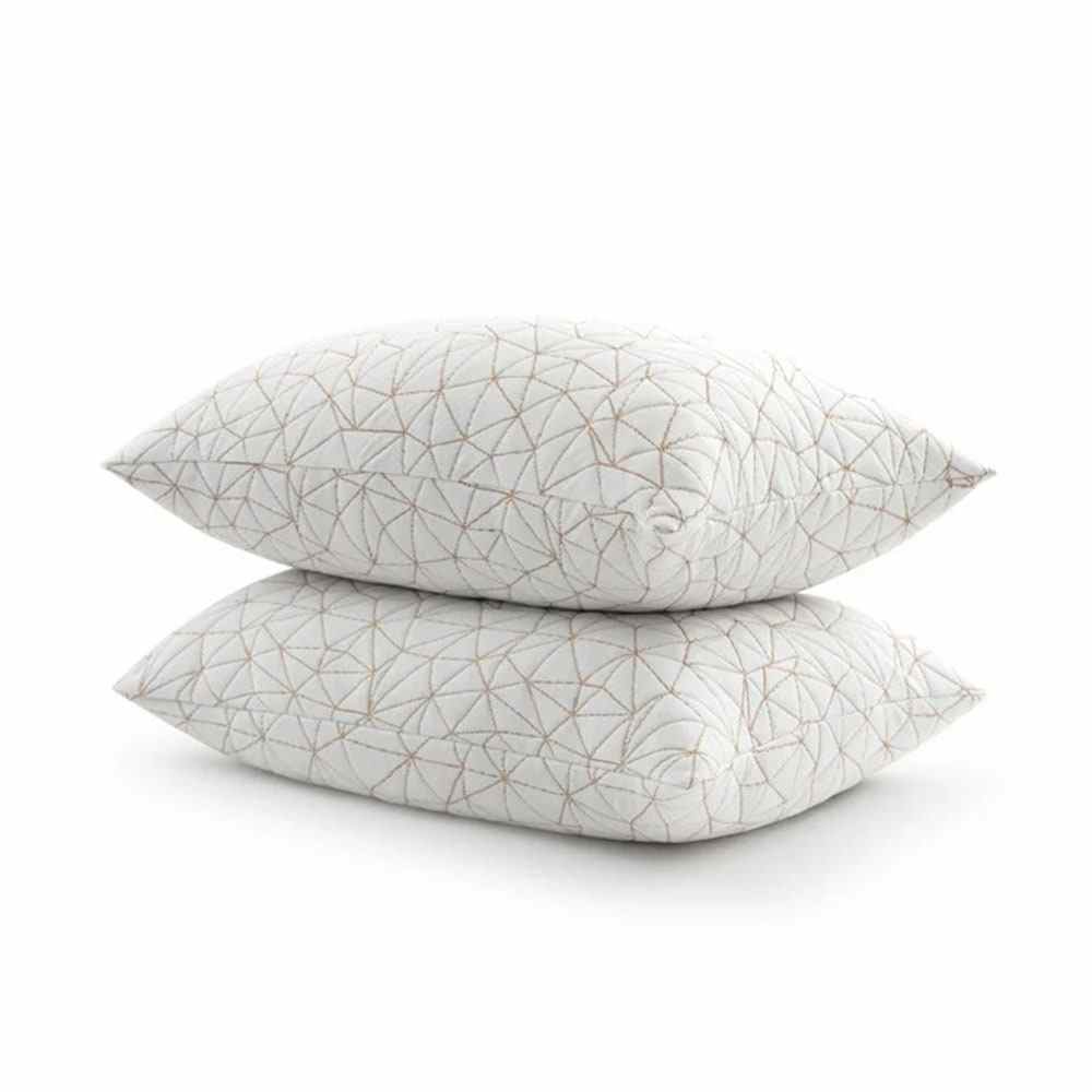 Two stacked white bed pillows
