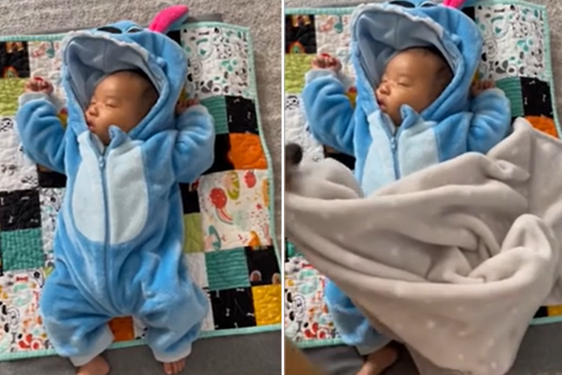 Baby Koa wird in eine Decke eingewickelt