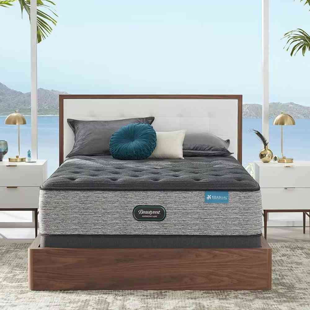 Graue Matratze auf weißem und braunem Bett