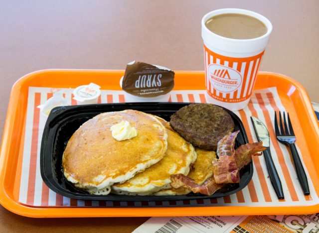 whataburger pancake platter with sausage, bacon, and coffee