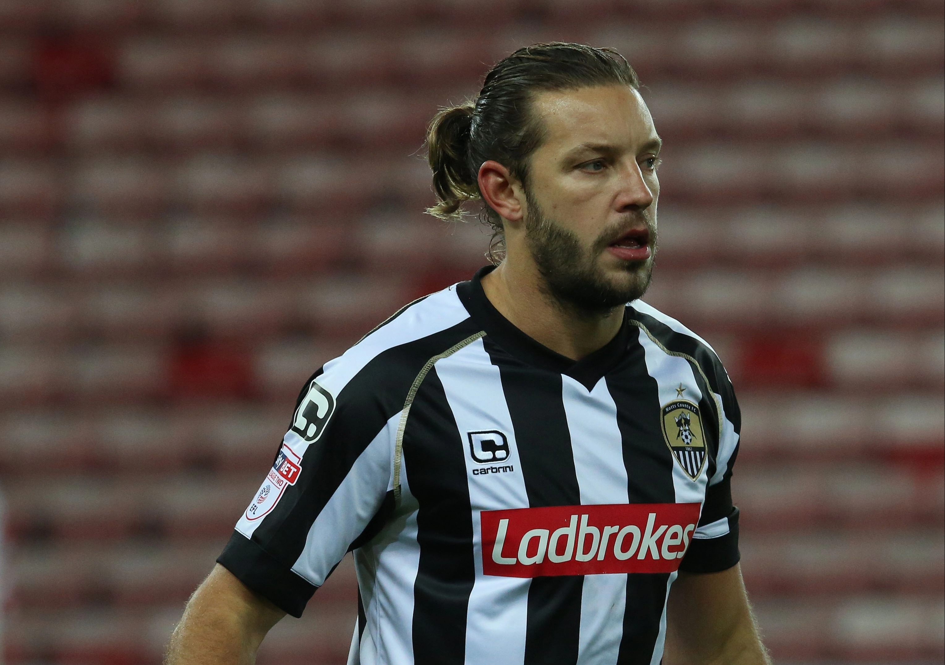 Smith grew his hair and beard out by the time he played for Notts County