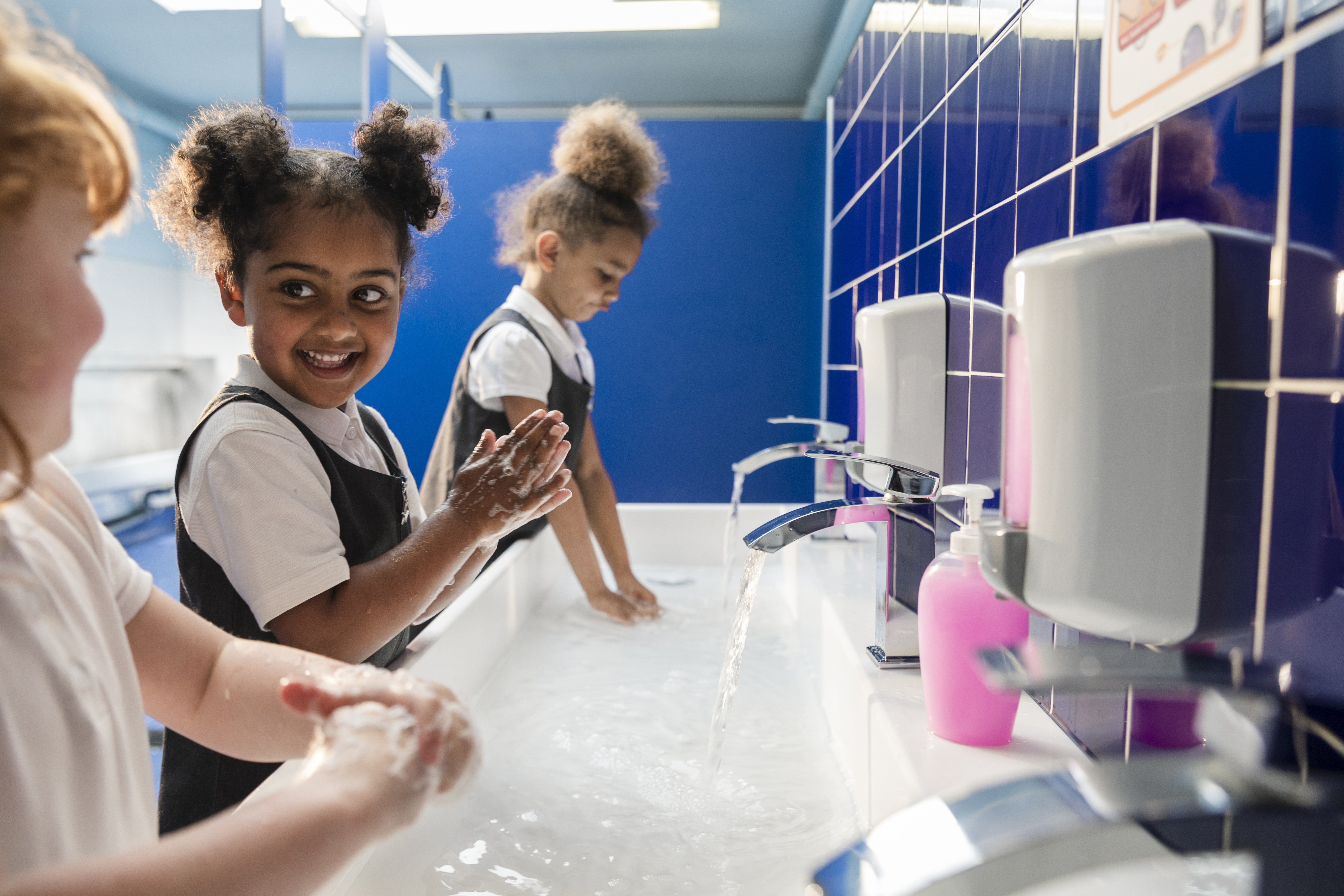 Teach your child how to wash their hands properly to help beat bugs in school toilets