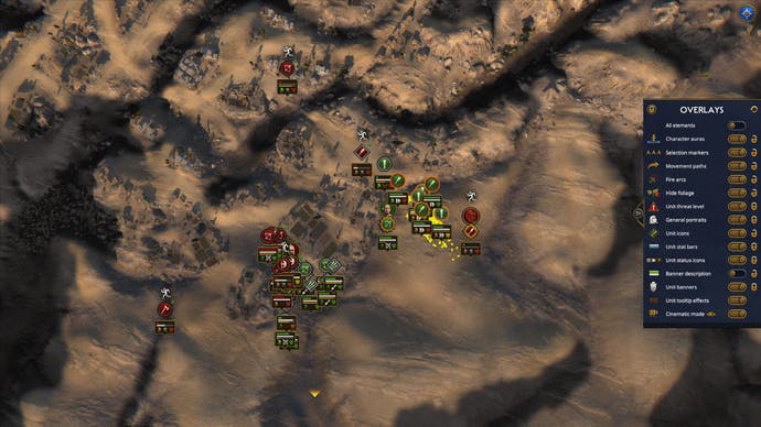 Eine himmelhohe Aufnahme einer Schlacht von Total War: Pharaoh zeigt Einheiten, die um eine kleine Siedlung aufeinanderprallen.