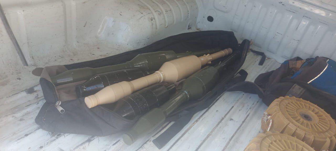 This image shows two YM-II, Iranian anti-tank mines and Iranian PG -7VR rockets. This was originally a Soviet anti-tank missile.