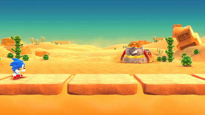 Sonic in einem Wüstenlevel mit einem Eggman-Roboter in der Ferne