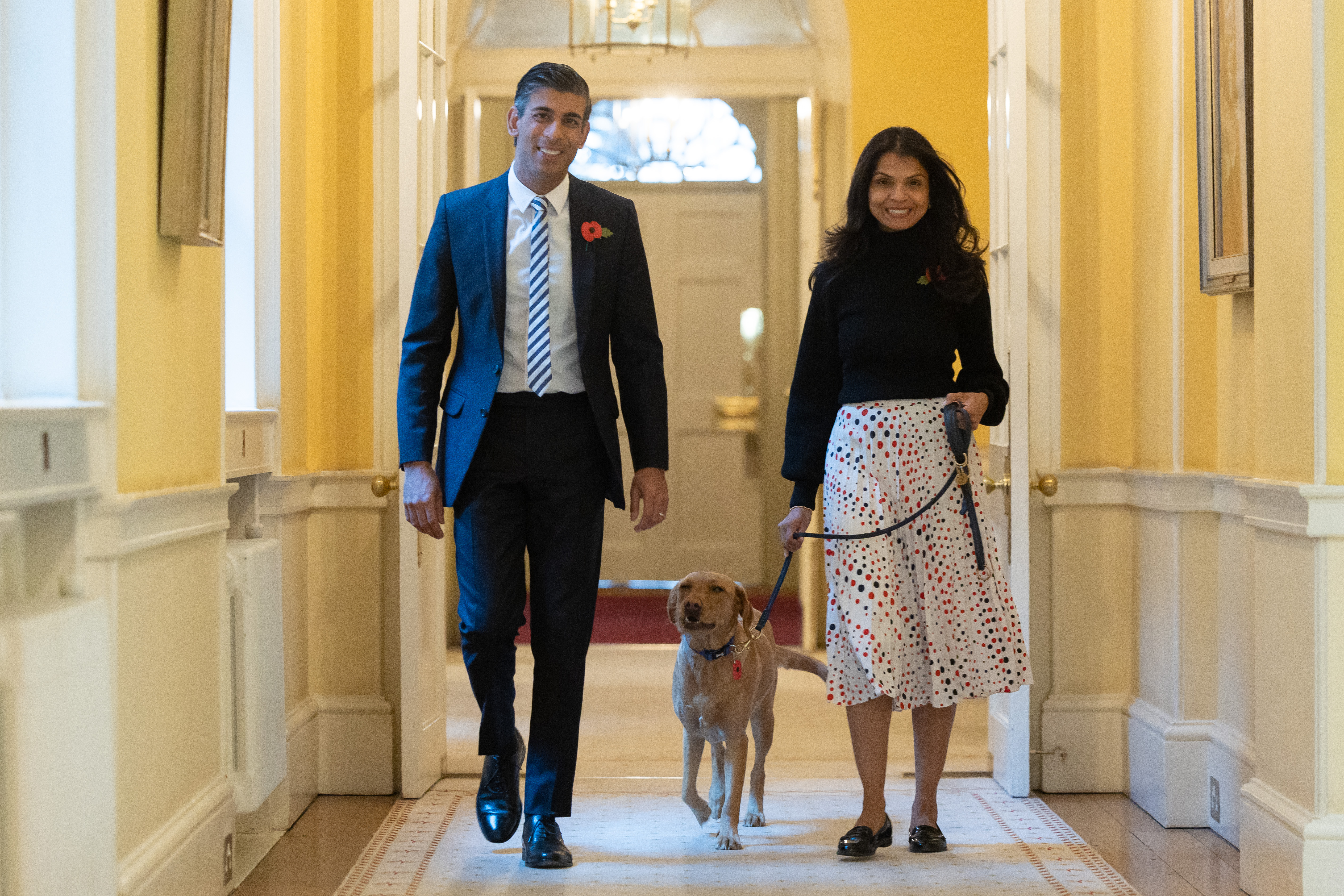 October, 2022: Rishi walks through Downing Street with his wife Akshata and their dog Nova