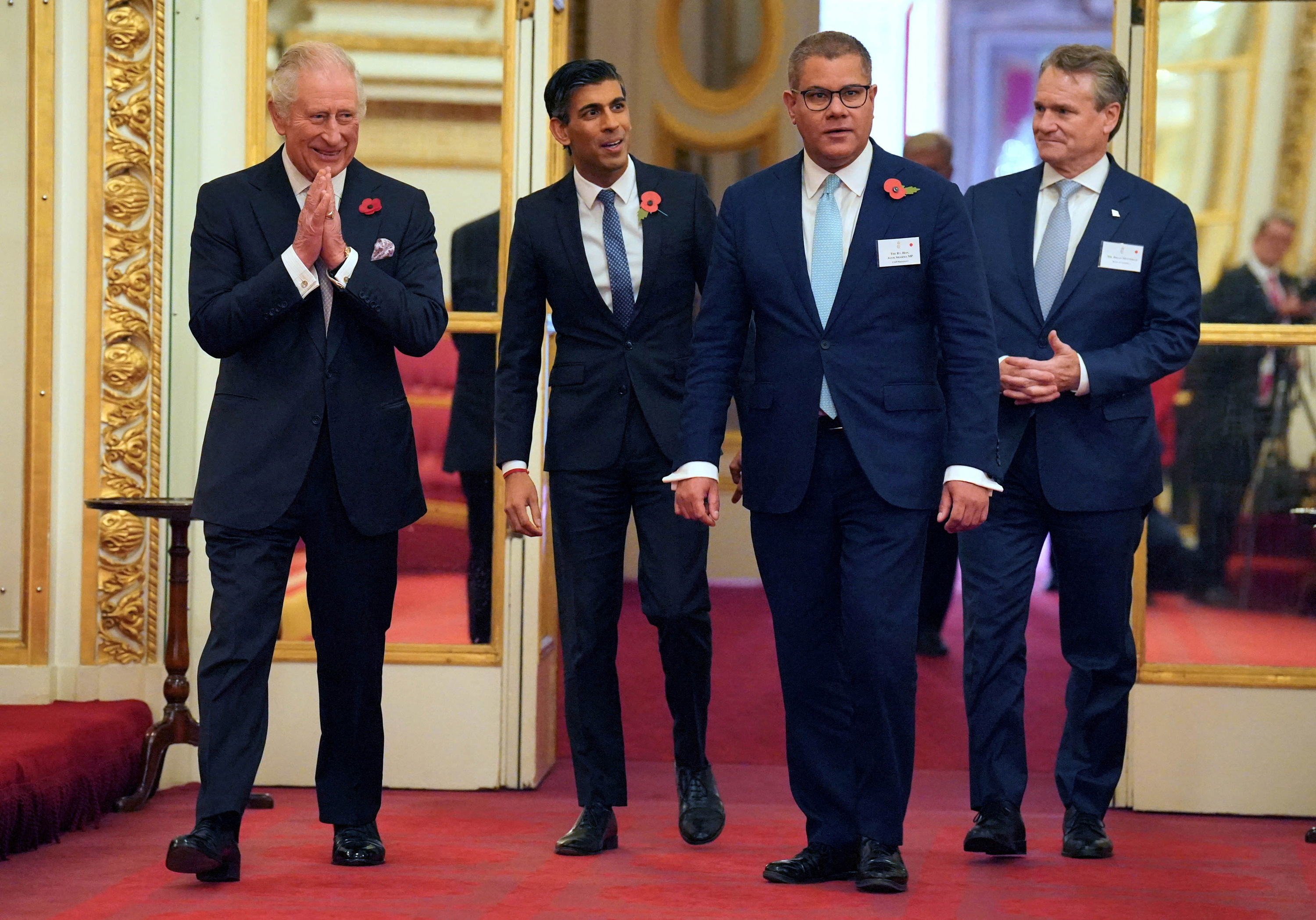 November, 2023: Rishi walks with King Charles and Alok Sharma during a Buckingham Palace reception ahead of the Cop27 Summit
