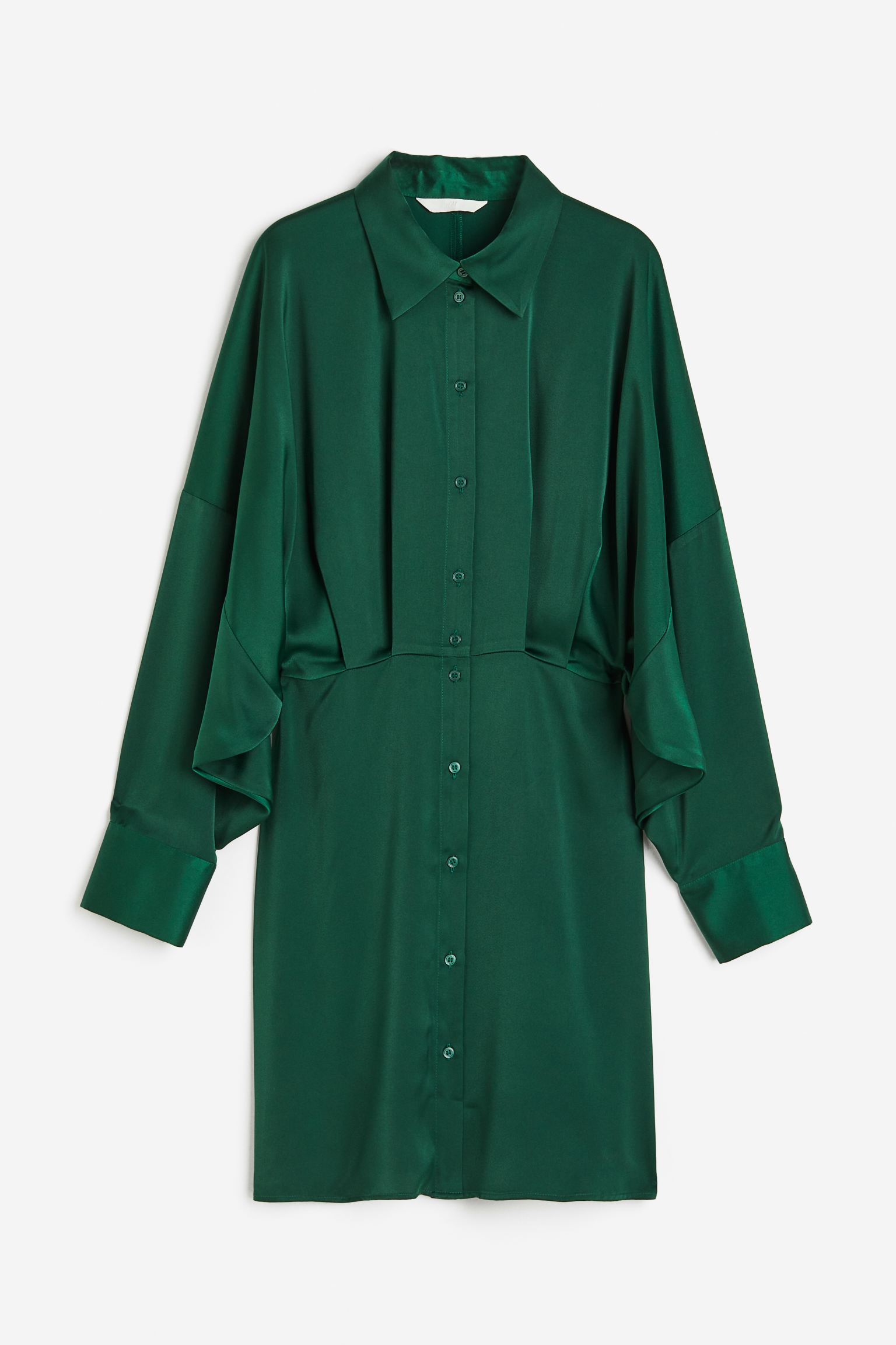 Dieses Kleid in sattem Waldgrün kann bei der Arbeit oder in der Freizeit getragen werden.
