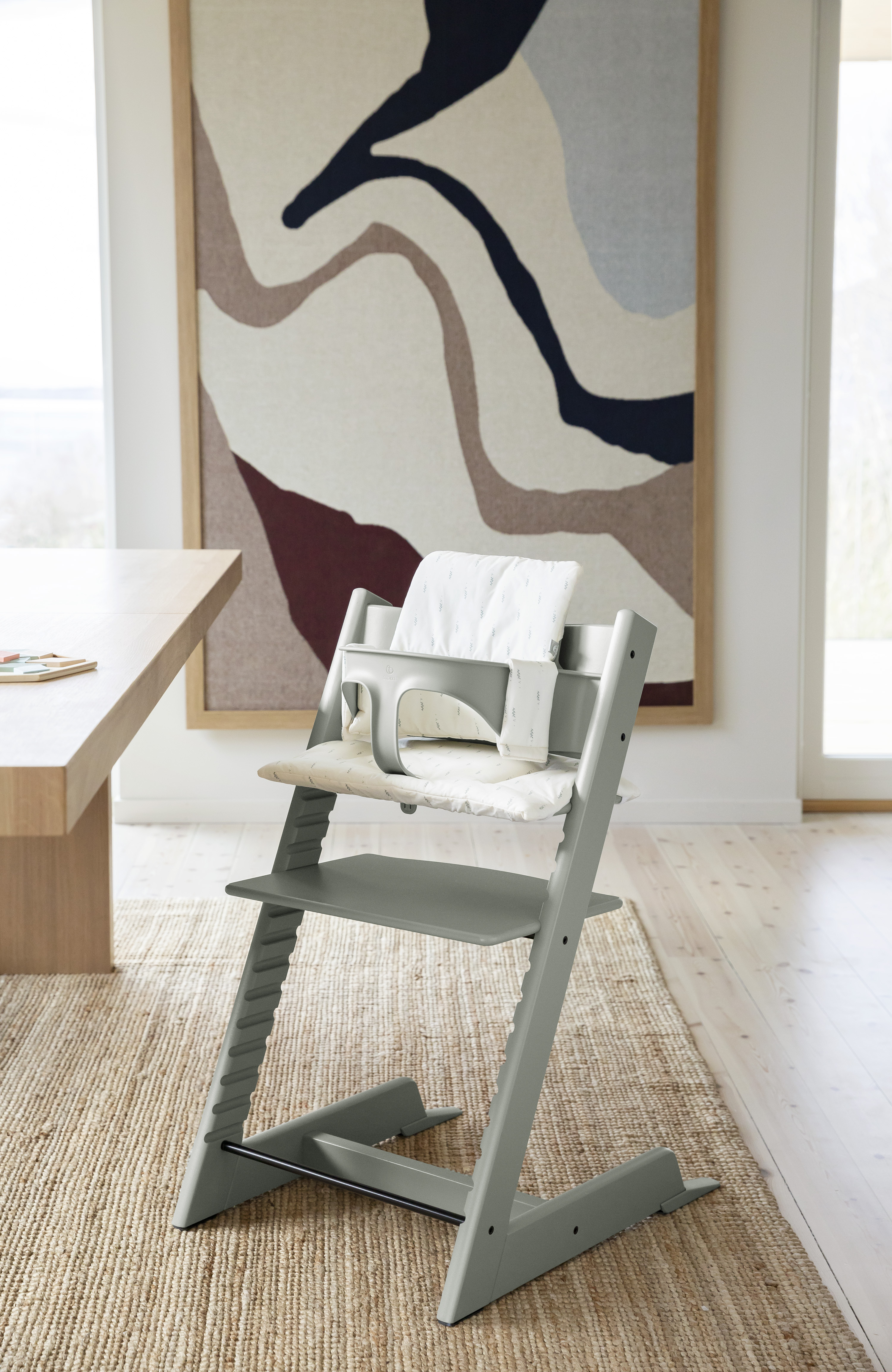 A high chair with a newborn kit, such as the Tripp Trapp from Stokke, grows with your child