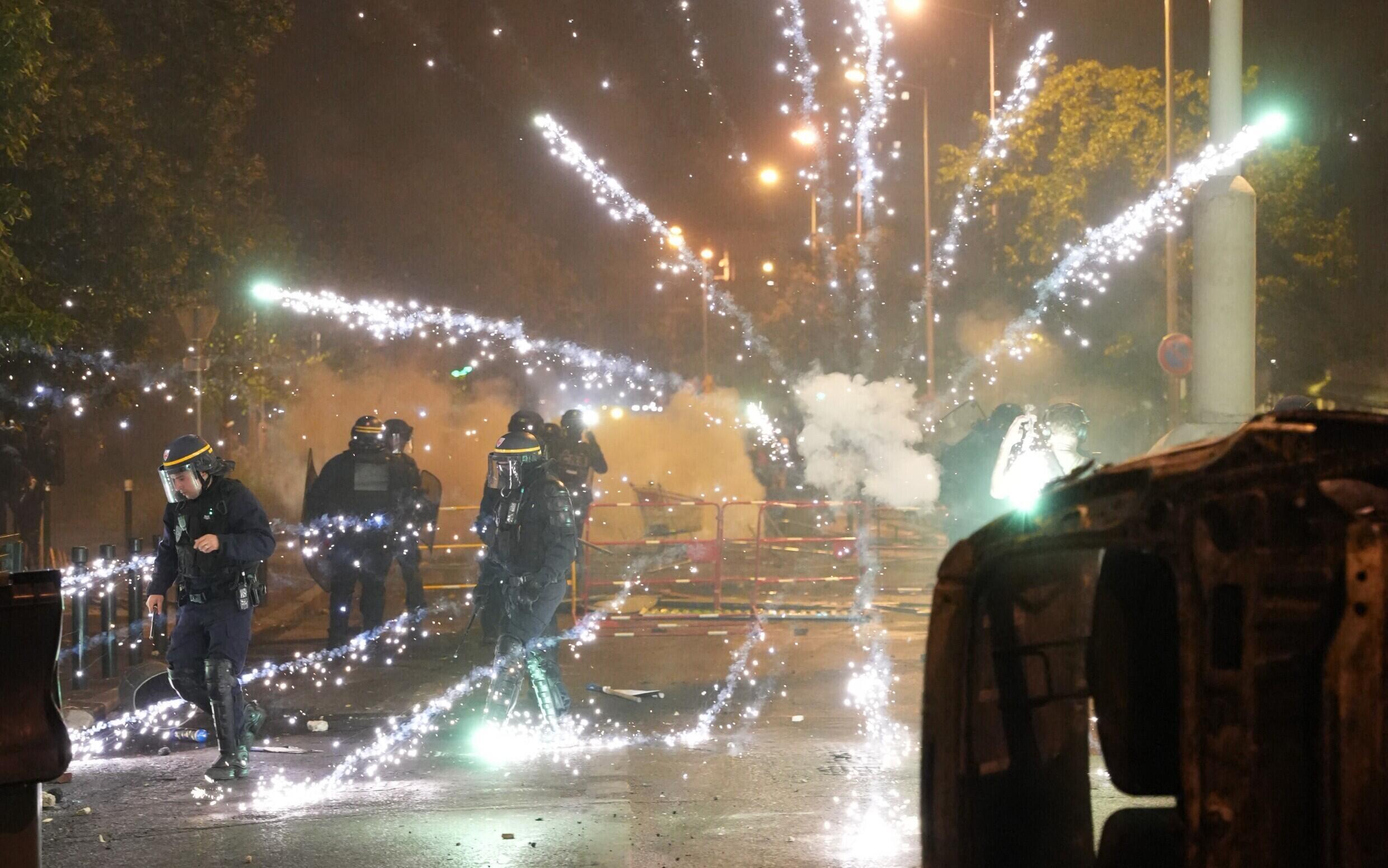 Fireworks target French riot police during protests in Nanterre, west of Paris, on June 28, 2023.