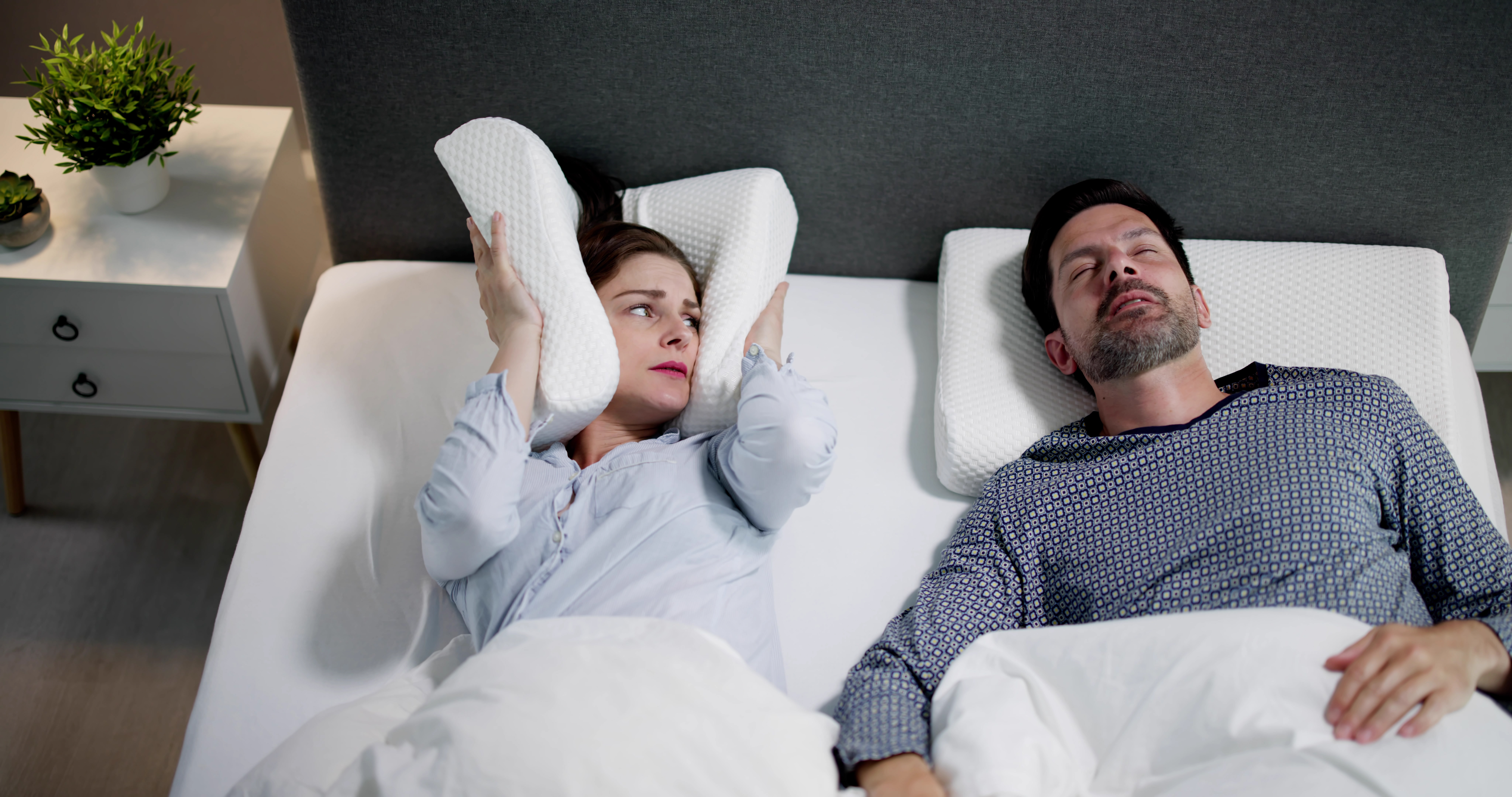 Record your partner snoring and listen to it every day for two weeks to help your brain take it on as a regular sound
