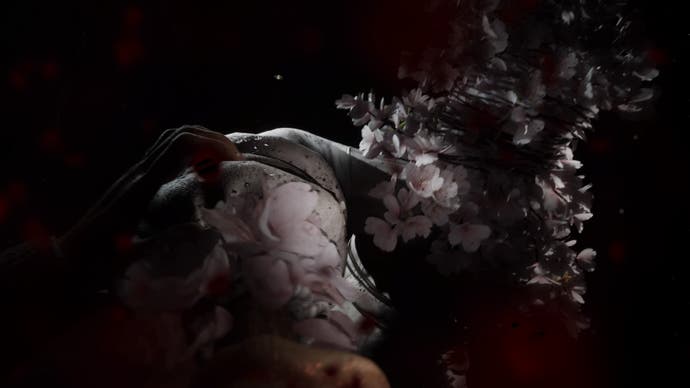 Silent Hill: Screenshot der Kurznachricht.  Eine bizarre Kreatur, in Draht gefesselt und scheinbar aus Kirschblüten gefertigt, greift aus der Dunkelheit nach Ihnen.