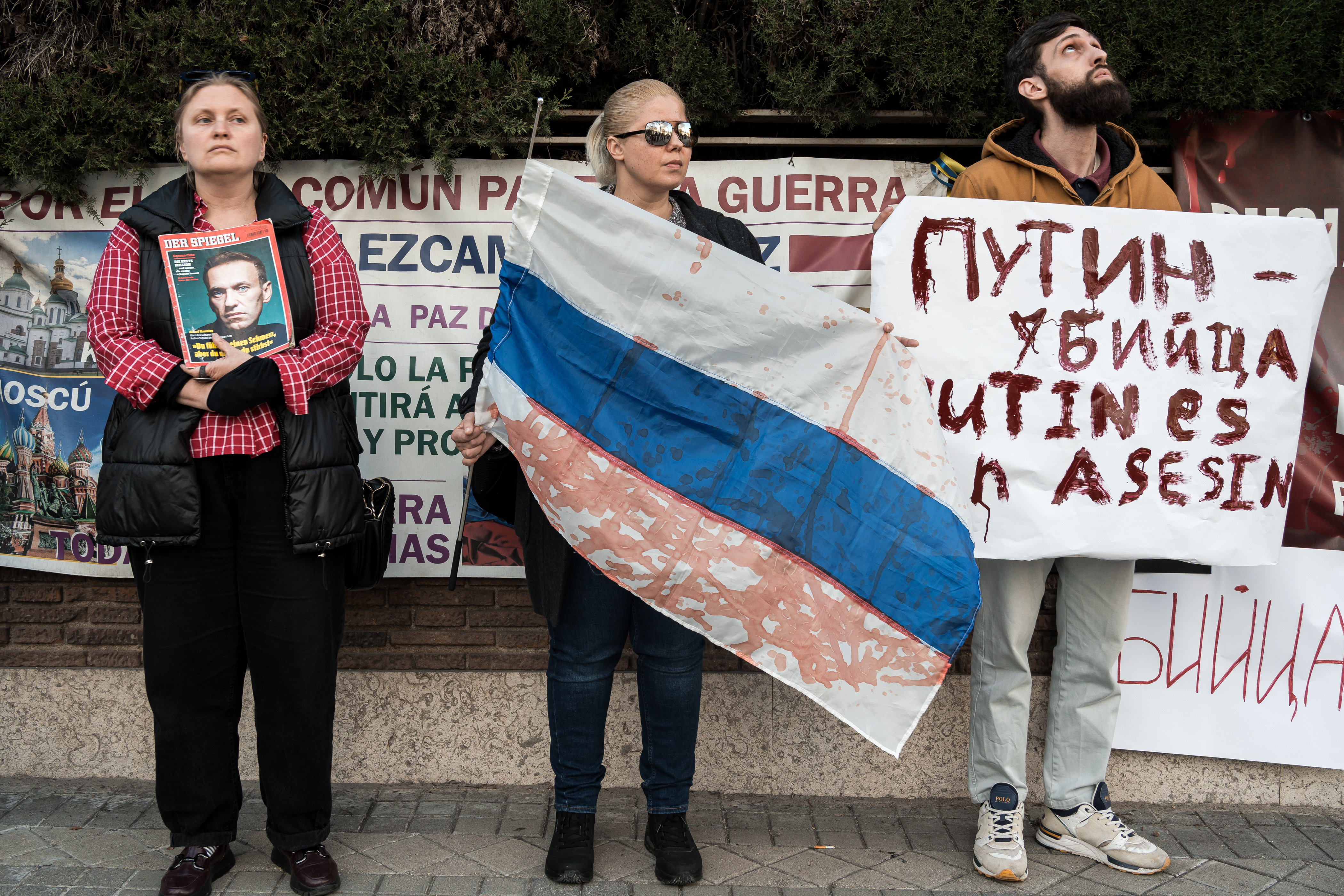 People gather in front of the Russian Embassy in Madrid, Spain