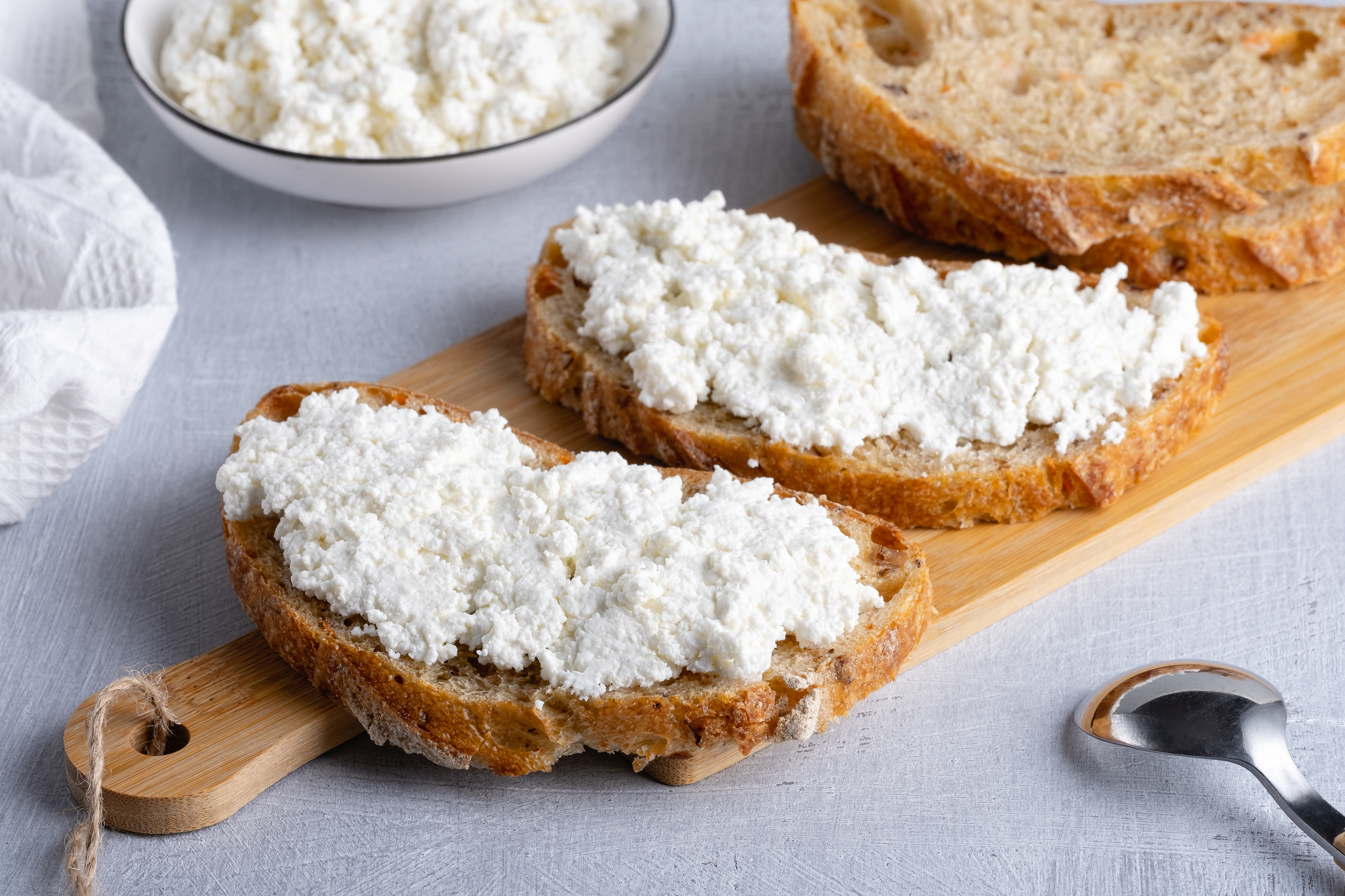 Swap milk for kefir, spread cottage cheese on toast, add miso or lentils into stews, or olives into salads