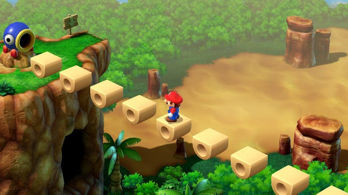 Mario überquert in diesem Bildschirm aus Super Mario RPG eine Brücke über einem kleinen Abgrund.  Am anderen Ende erwartet ihn eine Kanone.