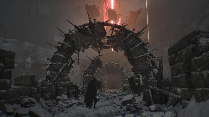 Spielercharakter in Lords of the Fallen im Schnee unter zerstörtem Torbogen