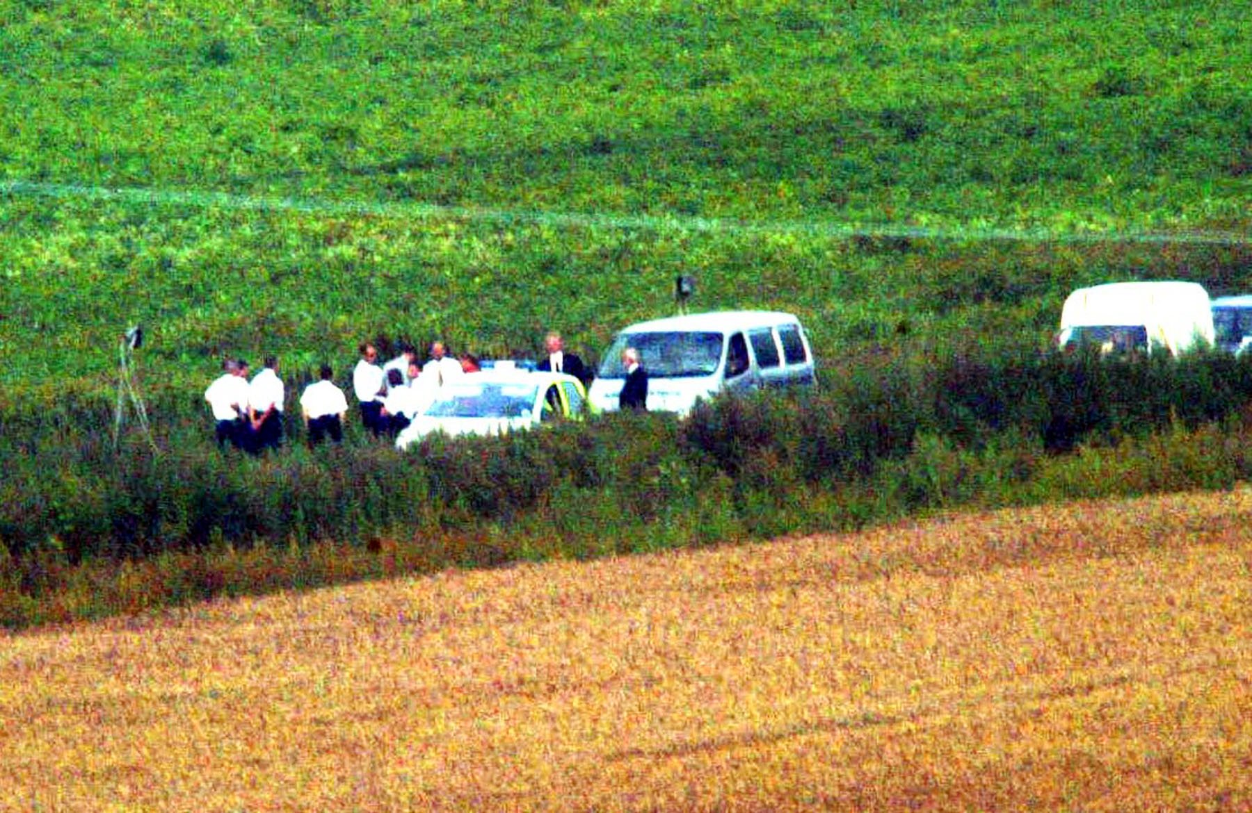 An ambulance arrives at Wangford Fen, near Lakenheath, Suffolk, after the two bodies were found