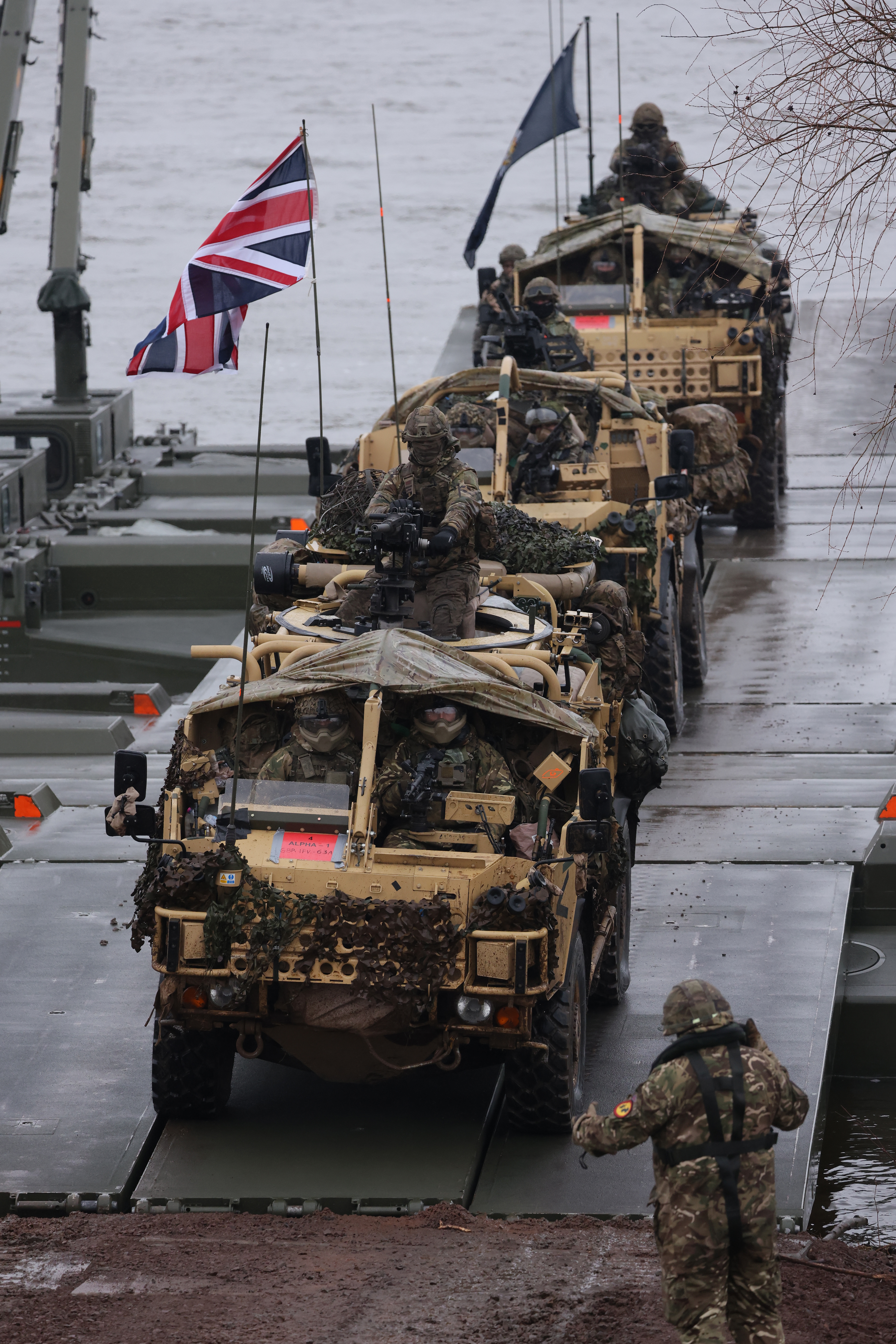 British troops drive Jackal combat vehicles during a Nato military exercise in Poland