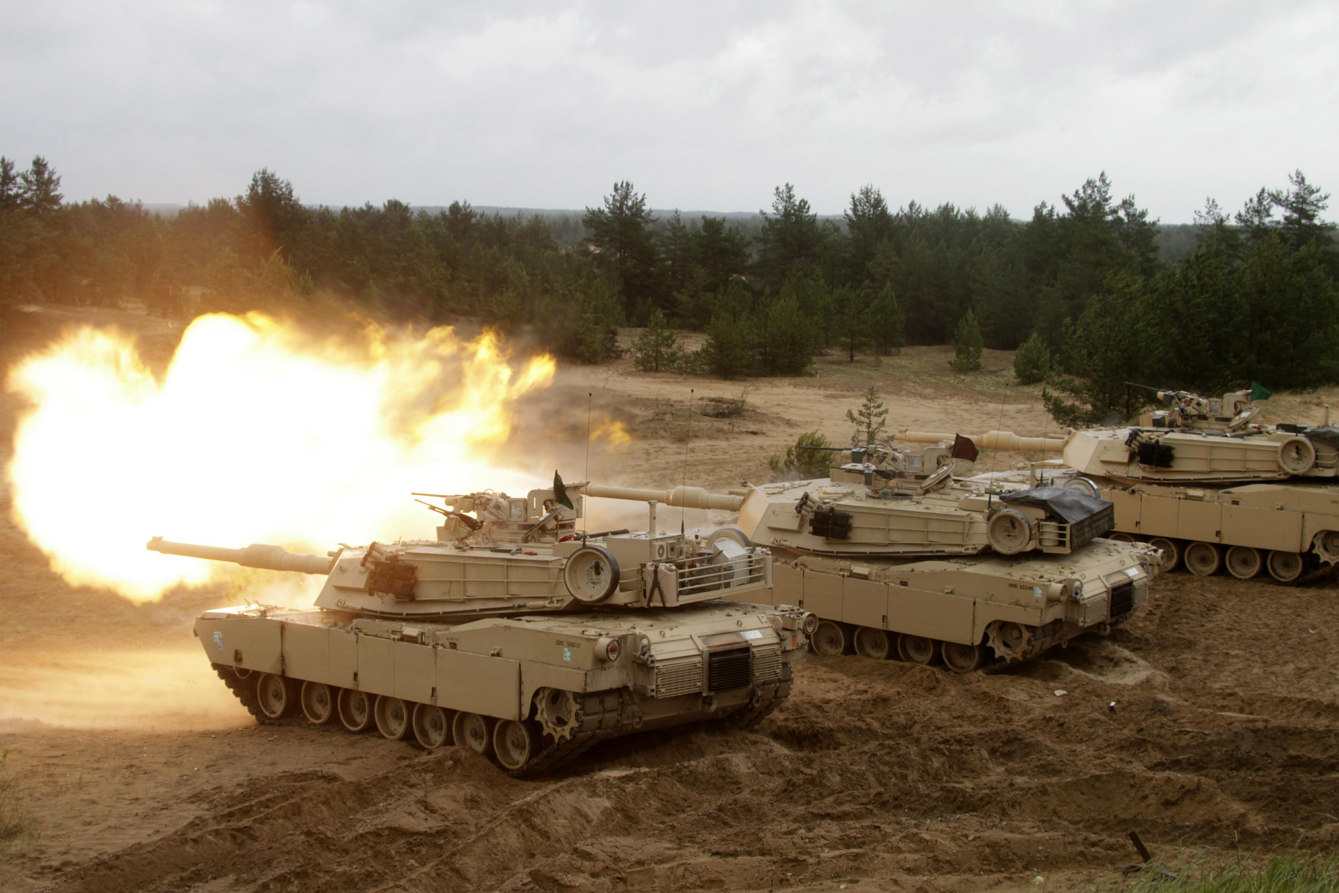 A US Army Abrams tank fires during the Saber Strike military exercises in Adazi military training area, Latvia