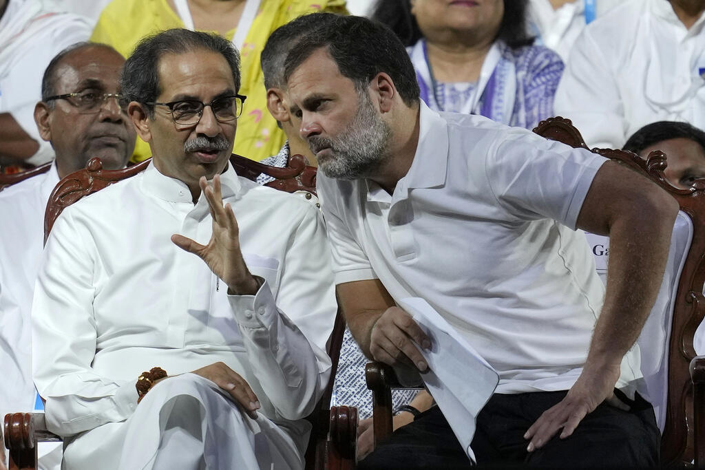 Congress leader Rahul Gandhi (R) with Uddhav Thackeray, leader of the Shiv Sena (UBT) party in Mumbai, March 17, 2024.