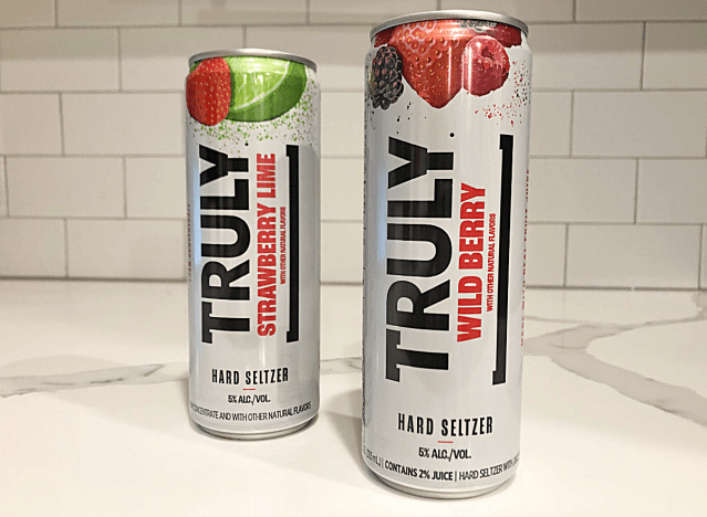 two cans of truly seltzer on a counter.